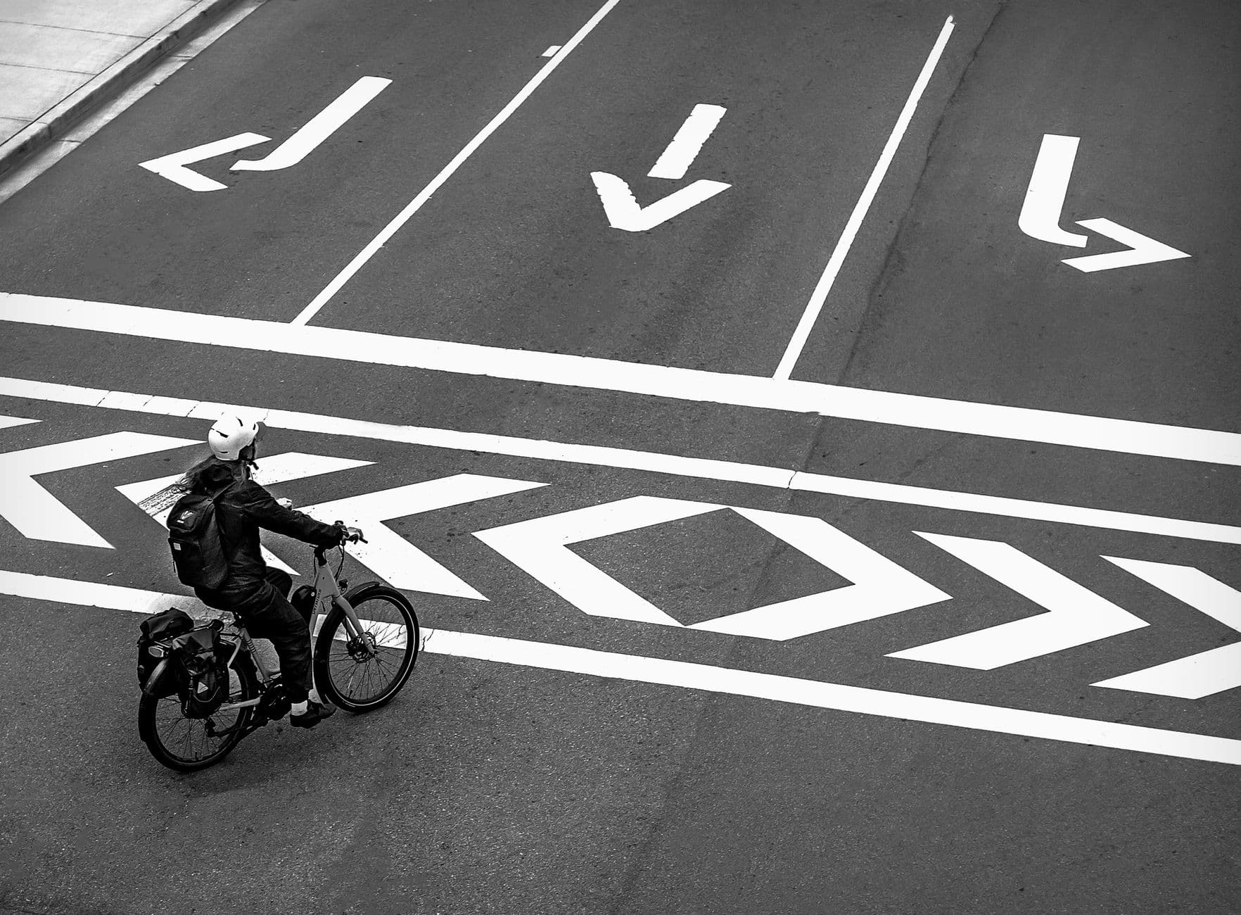 Image illustrating: A cyclist on a Walloon road near Namur, with traffic and a marked cycling lane v (editorial)