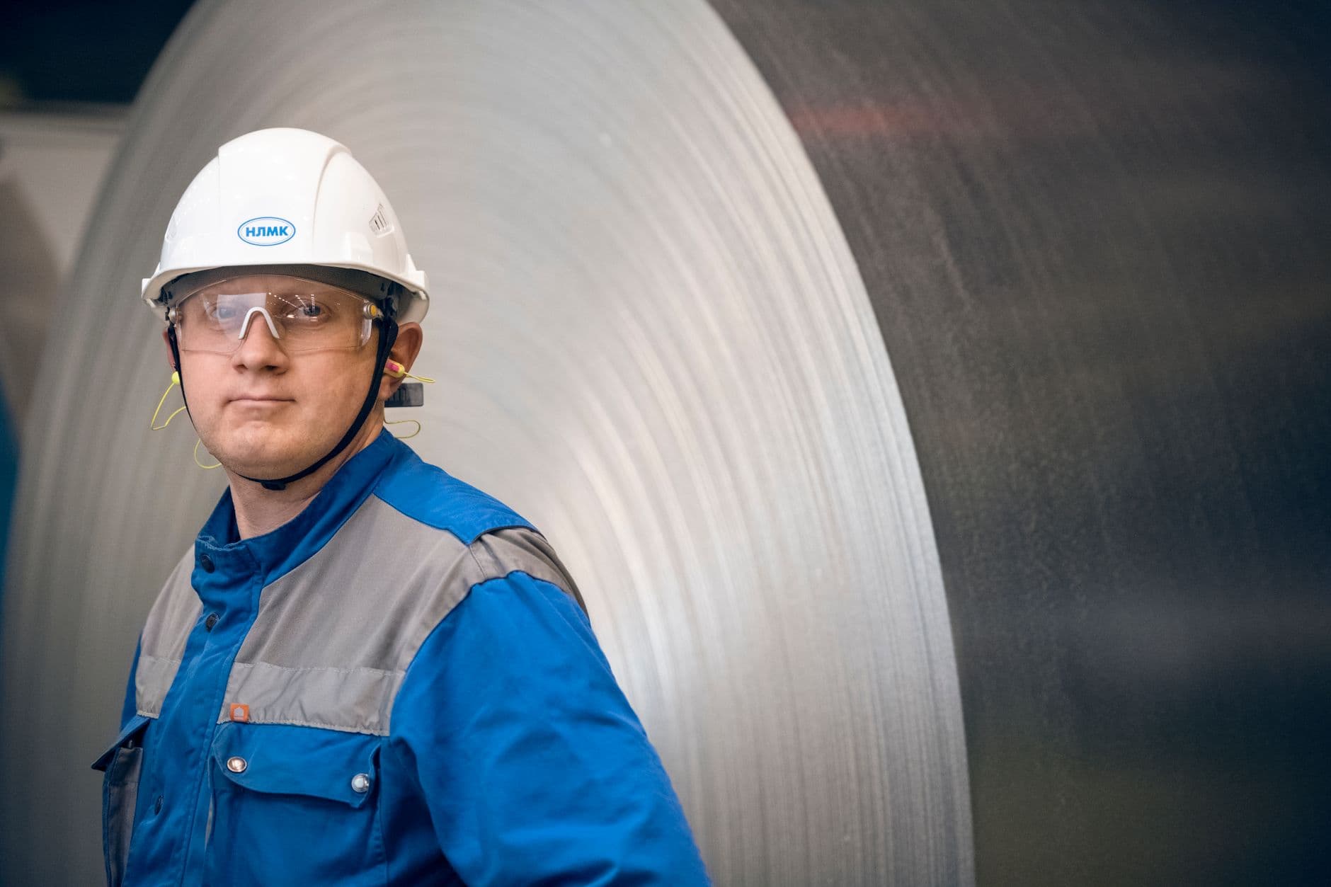 Image illustrating: Steel coils and industrial rolling equipment at a Belgian steel plant (editorial)