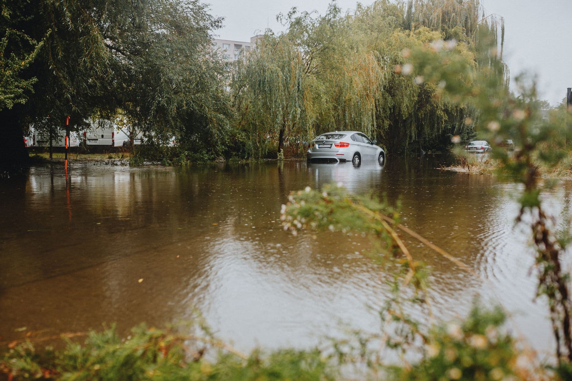Image illustrating: Flood barrier and high water along a Flemish river or coastal dike (editorial)