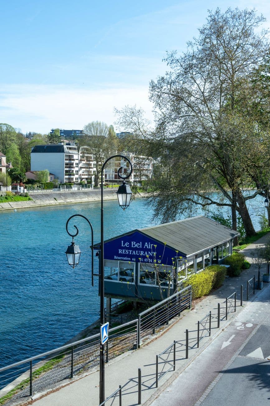 Image illustrating: Exterior or dining-room scene of a riverside Namur-area restaurant reopening aft (editorial)