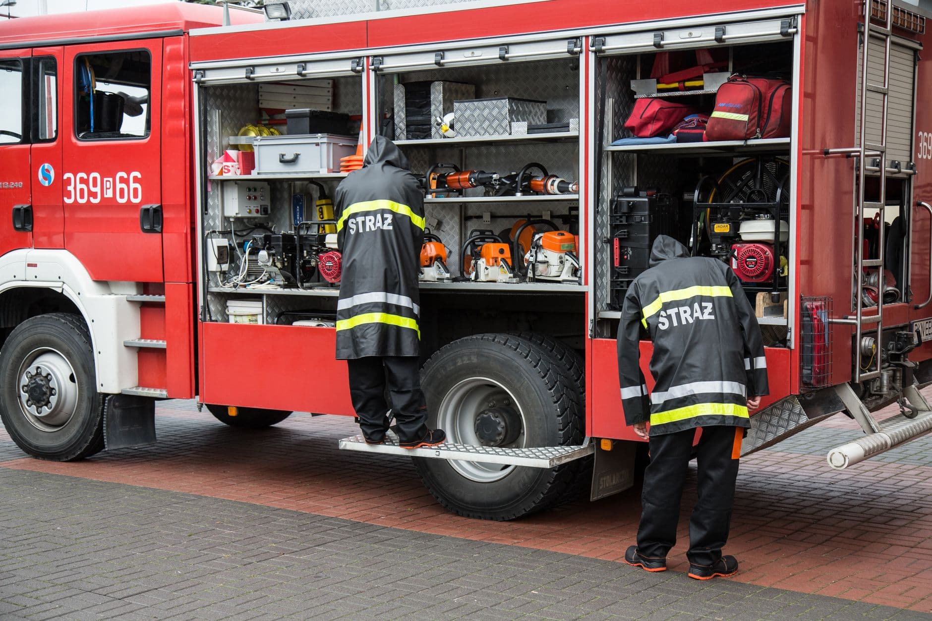 Image illustrating: Firefighters and emergency vehicles near an industrial building in Tubize after (editorial)