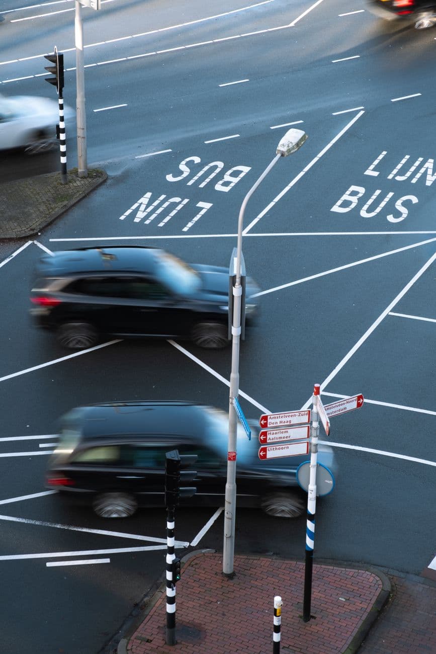 Image illustrating: A Tesla on a Flemish public road with road markings and traffic signs visible (editorial)