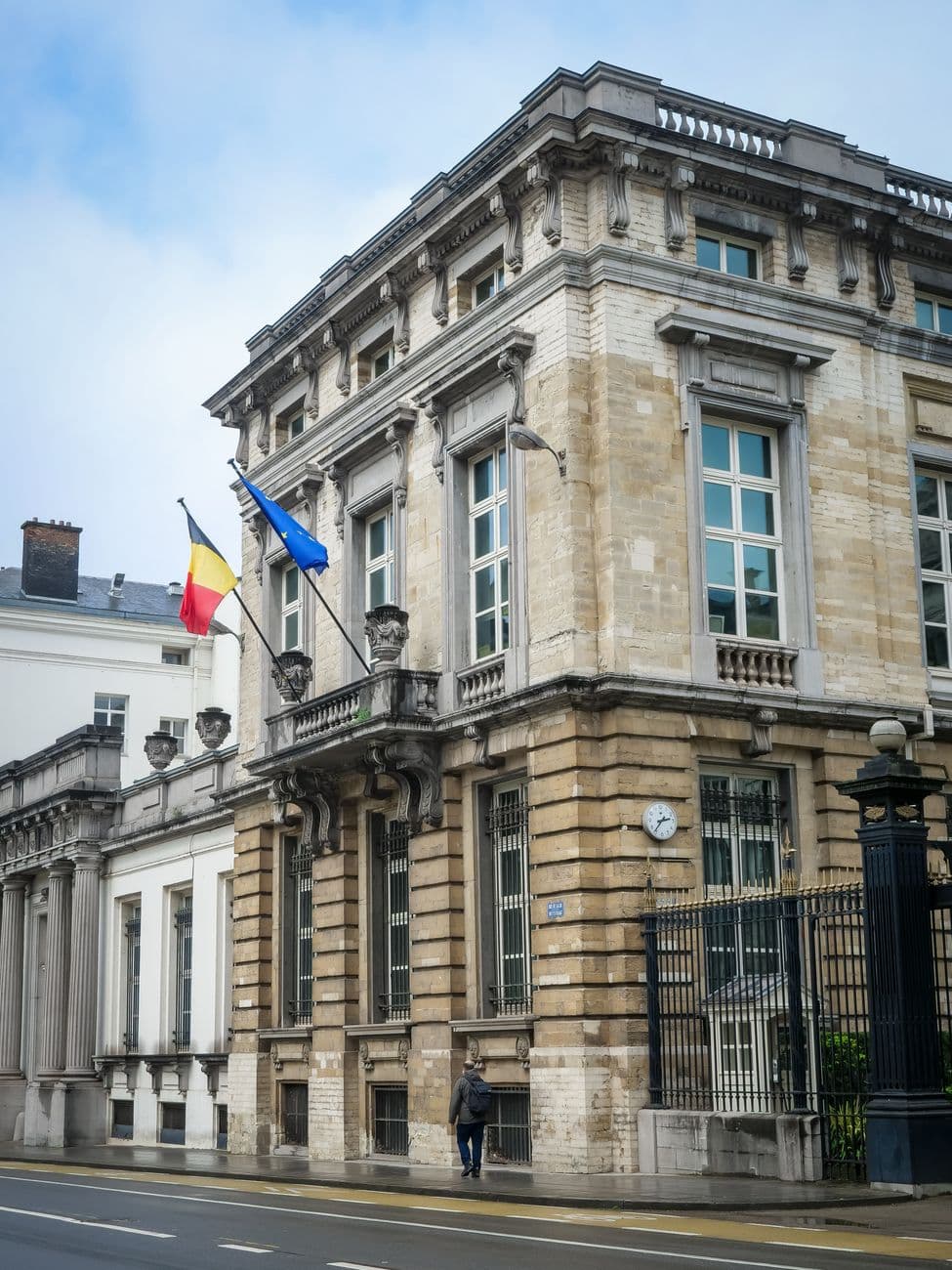 Image illustrating: Cyclists carrying bundles of school letters outside a French-speaking Belgian sc (editorial)