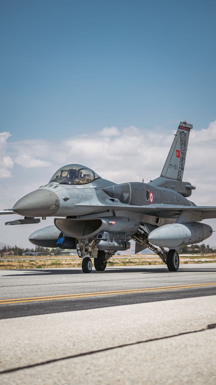 Image illustrating: Belgian F-16 fighter jet on a runway with Ukraine war context (editorial)