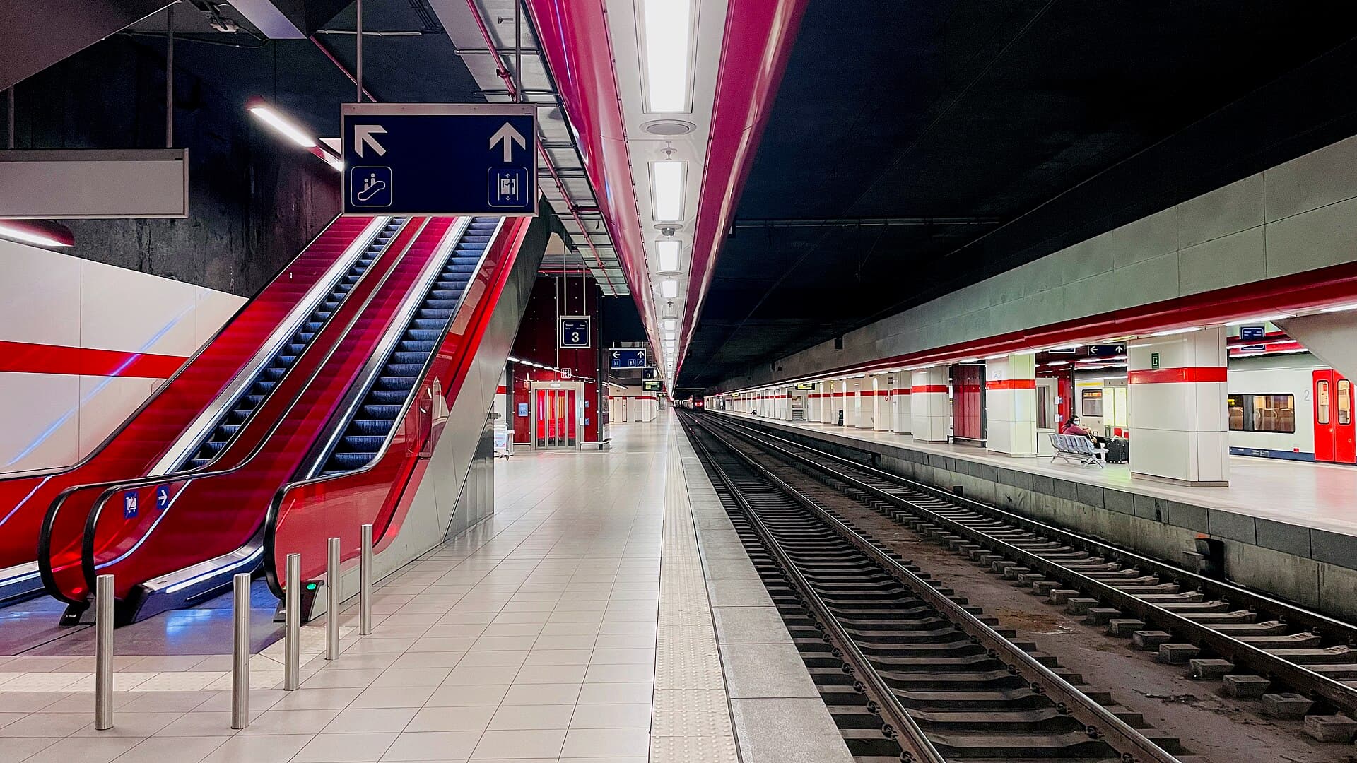 Image illustrating: Early-morning train platform at Brussels Airport-Zaventem station with airport t (editorial)